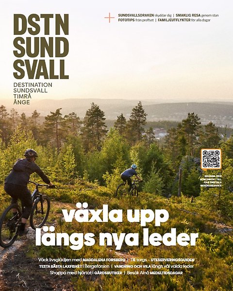 Bild på ett magasinomslag. På bilden syns det två cyklister som cyklar i en skog.